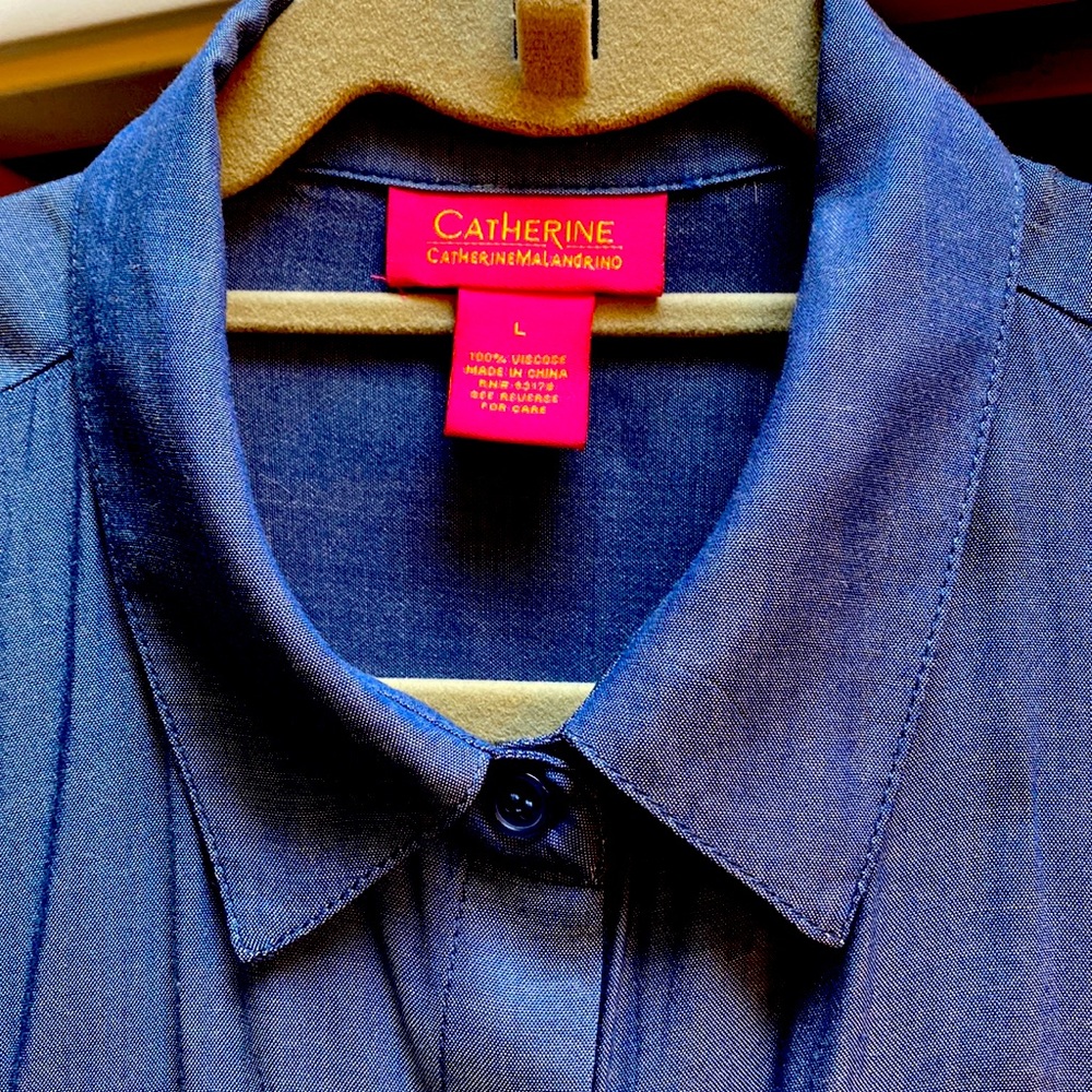 100% viscose button front blouse.